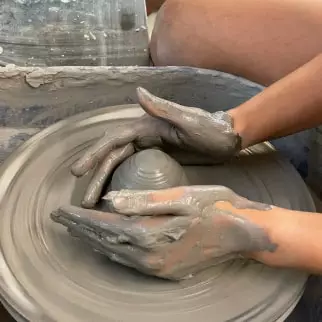 a student practicing on the wheel