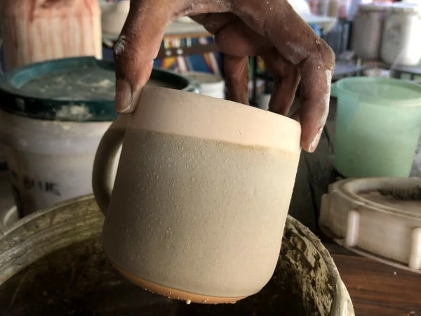 glazing a ceramic mug